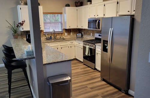 Corpus Christi House | Bottom Level Canal Water Front Home with Spacious Deck, Boat Dock, and Parking!