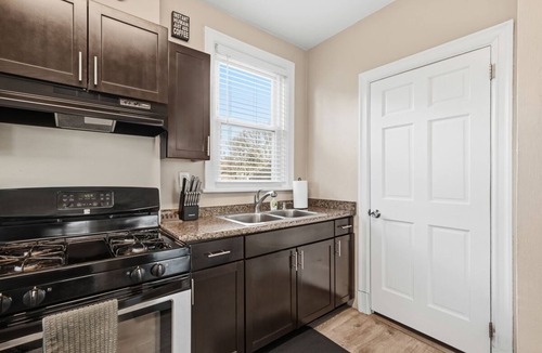Brighton Heights Apartment | Bright 3BR near downtown with 2 private balconies, free parking, and a spotless, well-designed space. Easy access to stadiums, hospitals, and dining.