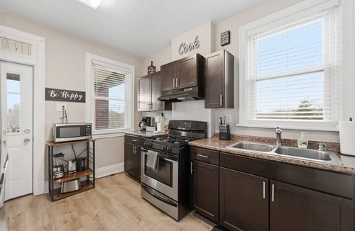 Brighton Heights Apartment | Bright 3BR near downtown with 2 private balconies, free parking, and a spotless, well-designed space. Easy access to stadiums, hospitals, and dining.