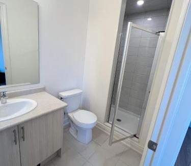 Richmond Hill Apartment | Bright bedroom with private bathroom
