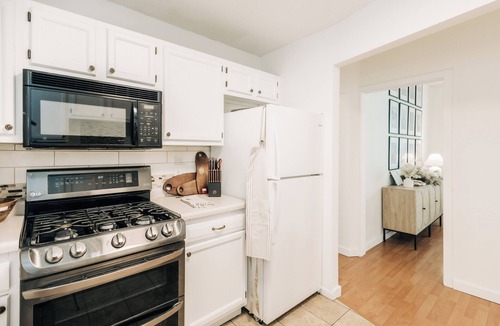Summit - University House | Bright, chic & spacious by Summit/Hamline in St Paul with porch and swing chairs