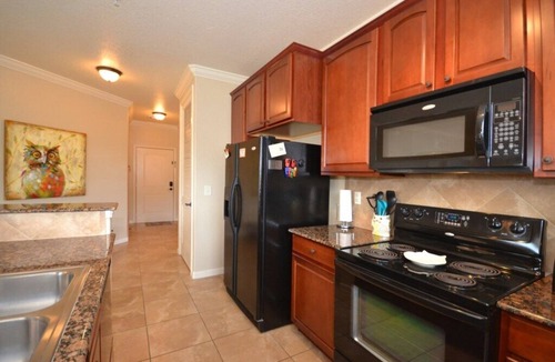 Wellington Condo | Bright condo with south facing balcony overlooking pond