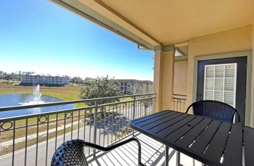 Wellington Condo | Bright condo with south facing balcony overlooking pond