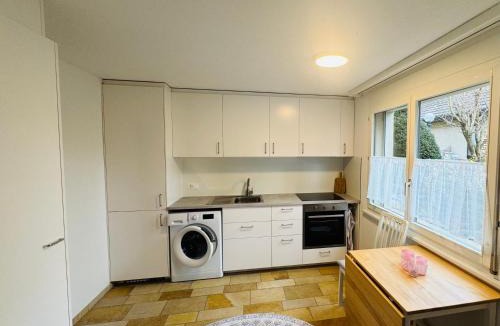 Wurenlos Apartment | Bright furnished Studio with workspace and garden area near Zurich