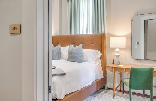 Granbury Hotel | Bright King Room in Granbury Hotel on the Historic Granbury Square