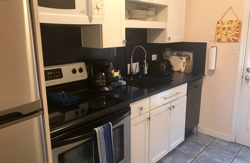 Truman Annex Condo | Bright & Modern Condo—7 MinWalk to the Beach! Pool, Bikes & 2 Furnished Porches!