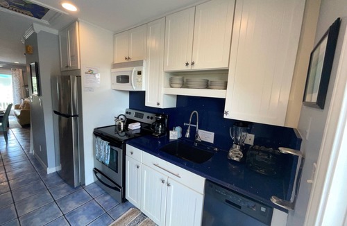 Truman Annex Condo | Bright & Modern Condo—7 MinWalk to the Beach! Pool, Bikes & 2 Furnished Porches!