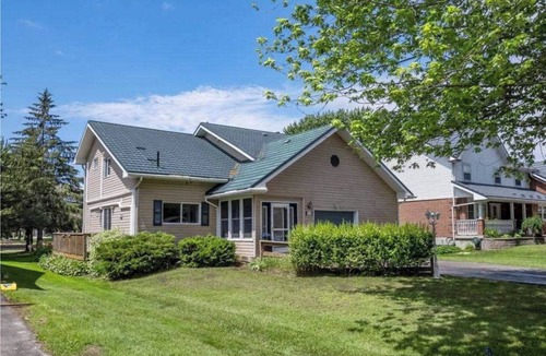 Lagoon City Cottage | Bright Modern Waterfront Cottage w/hot tub - 5 min from the beach!
