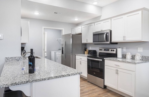 Branson West Condo | Bright Open Floorplan with Hot Tub, Private Deck, Arcade, Golf Course & High-End Decor