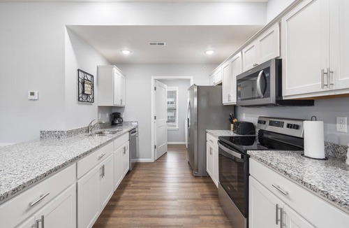 Branson West Condo | Bright Open Floorplan with Hot Tub, Private Deck, Arcade, Golf Course & High-End Decor