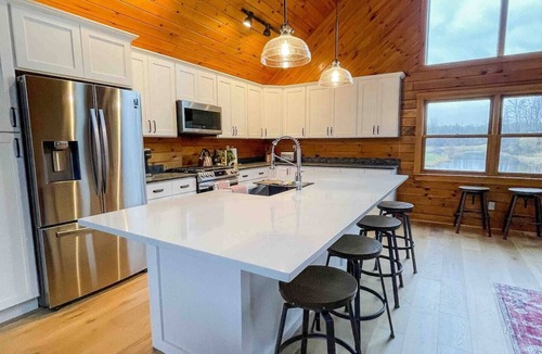 Wales Center House | Bring family and friends to this beautiful, spacious, open plan log home.