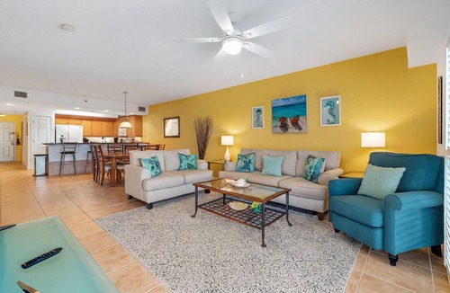 New Smyrna Beach Condo | Build family memories at this 3BR condo in New Smyrna Beach, just steps across the street from the sand. Enjoy a pool & spa outside your door, a luxe master bath, spacious bedrooms, and resort-style amenities in a gated community.