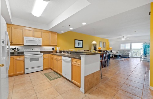 New Smyrna Beach Condo | Build family memories at this 3BR condo in New Smyrna Beach, just steps across the street from the sand. Enjoy a pool & spa outside your door, a luxe master bath, spacious bedrooms, and resort-style amenities in a gated community.