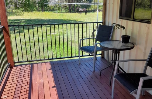 Coonarr Cabin | Bundaberg PETS A/C Small Rustic Cabin 1 bed kitchenette fridge bathroom BBQ deck