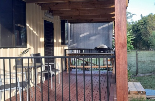 Coonarr Cabin | Bundaberg PETS A/C Small Rustic Cabin 1 bed kitchenette fridge bathroom BBQ deck
