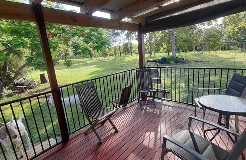 Coonarr Cabin | Bundaberg PETS A/C Small Rustic Cabin 1 bed kitchenette fridge bathroom BBQ deck
