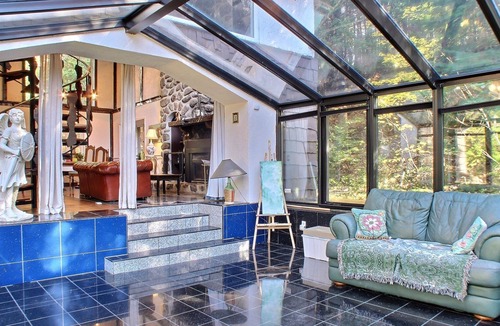 Sainte-Marguerite-du-Lac-Masson House | A Swiss Chalet on Doncaster river + Private Mini Island