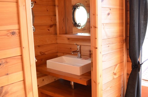 Chassenard Boat Rental | Cabin dinghy at anchor