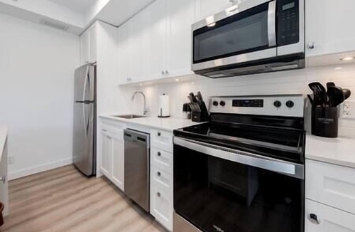 Bow Riverfront Apartment | Calgary Tower Views | UG Park | Rooftop Patio