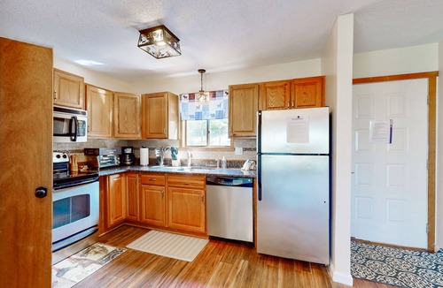 Village at Camelback House | Calming mountain-view home with pool access, game room, grill, & balcony