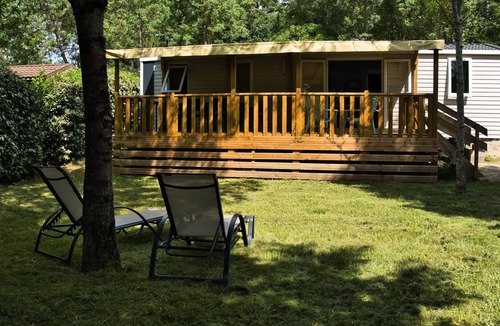 Castelnau-de-Montmiral House | Camping du Chêne Vert * - Bungalow Comfort 5pers 38,50m2 with covered terrace 2 bedrooms shaded and half shaded 5 people