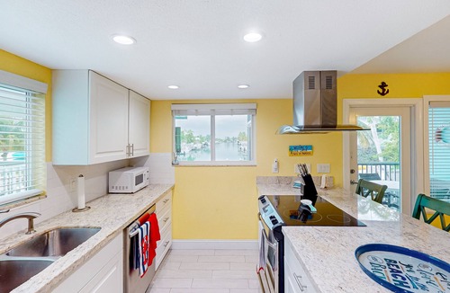 Key Colony Beach House | Canal-front home with Cabana Club access, water view, & private W/D