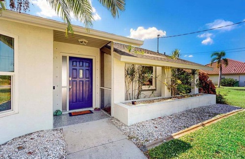 Pebble Beach House | Canal-front home with private pool, grill, patio, AC, W/D & gorgeous views