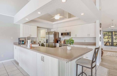 Pebble Beach House | Canal-front home with sandy beaches, golf courses, dock, & refreshing pool