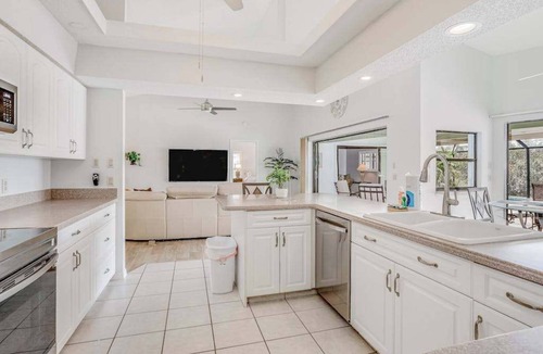 Pebble Beach House | Canal-front home with sandy beaches, golf courses, dock, & refreshing pool