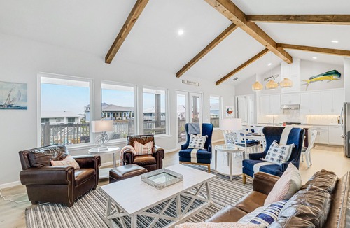 City-by-the Sea House | Canal-front home with private dock, covered deck, pool & W/D