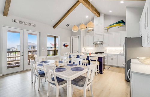 City-by-the Sea House | Canal-front home with private dock, covered deck, pool & W/D