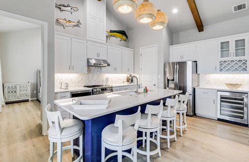 City-by-the Sea House | Canal-front home with private dock, covered deck, pool & W/D