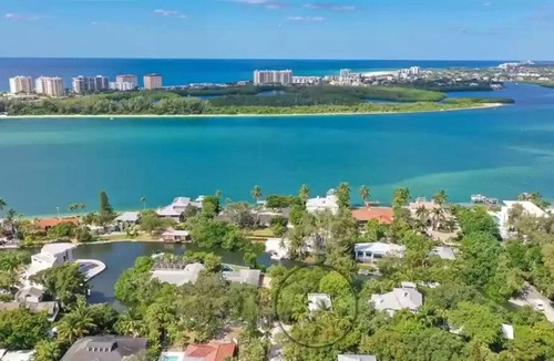 Bay Isle House | Canal-front home with a dock, GULF VIEWS, Shell Beach access.