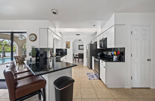 Port Charlotte House | CANAL HOME! WARM PRIVATE POOL! FAMILY MEMORIES! WIFI! GRILL! BABY SUPPLIES!