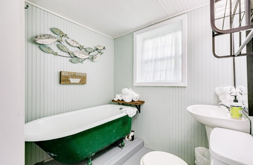 Jamaica Beach Cottage | Canal-View Home w/Shared Pool & Boat Slip, Fish From Deck - Dogs OK