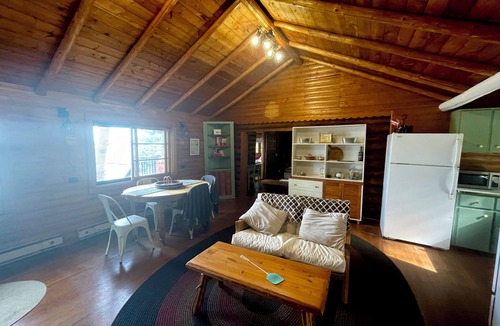 Eagle River Cabin | Casa de Campo, a magical log cabin nestled in the woods directly on the lake.