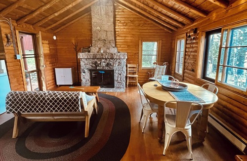 Eagle River Cabin | Casa de Campo, a magical log cabin nestled in the woods directly on the lake.