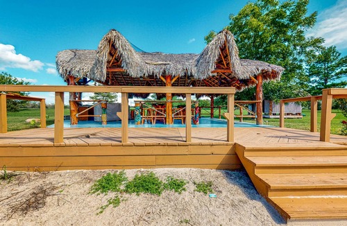 Waller Cabin | Cedar Cabin with Pretty Pond, Beach, Swimming Deck & Tropical Hut/Bar
