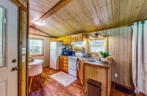 Waller Cabin | Cedar cabin with pretty pond, beach, swimming deck & tropical hut/bar