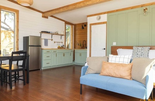 Marble Falls House | Cedar Haus - king bed and soaking tub