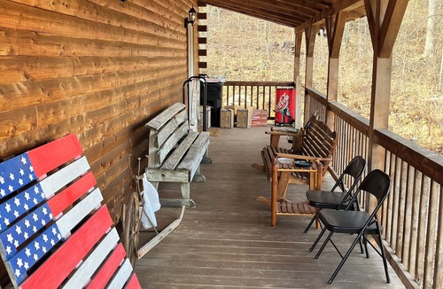 Saffell Cabin | Cedar log cabin overlooking spring-fed ponds with waterfalls at Wautauga Springs