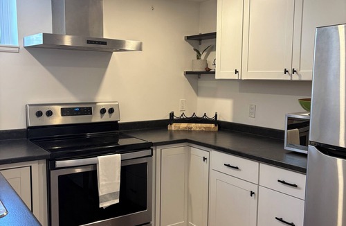 Bowmanville Apartment | Cedar Suite - Patio, full kitchen & in-suite laundry