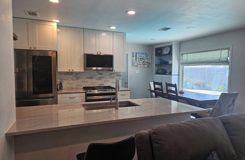 Haltom City House | Central DFW location with cozy fireplace and pool.