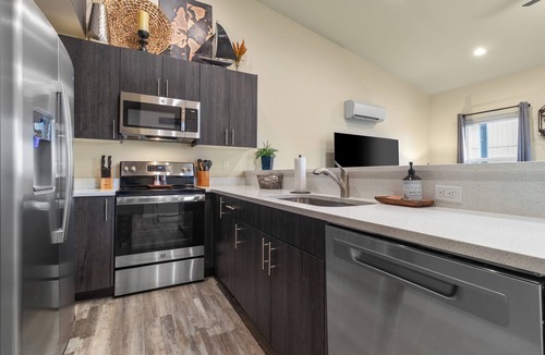 Grand Mound House | Centralia home minutes to NW Sports Hub. Modern two bedroom - primary ensuite. Main level bedroom with full bathroom adjacent. Full kitchen. Fully fenced backyard with covered patio. In home laundry - full size washer/dryer. Parking - 4 cars