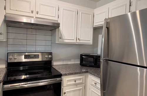 Woodcroft Apartment | centrally located 2 master suite main level stylish condo