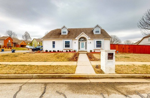 Jenks House | Centrally located home w/ a wood-burning fireplace