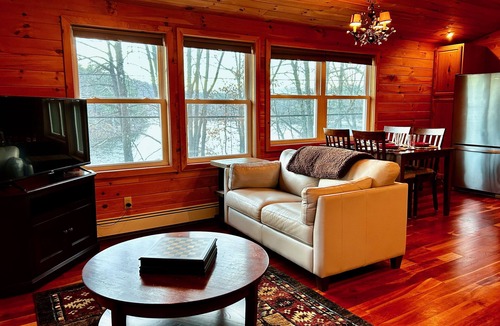 Lake Luzerne-Hadley Cottage | Centrally located, modern riverfront cottage