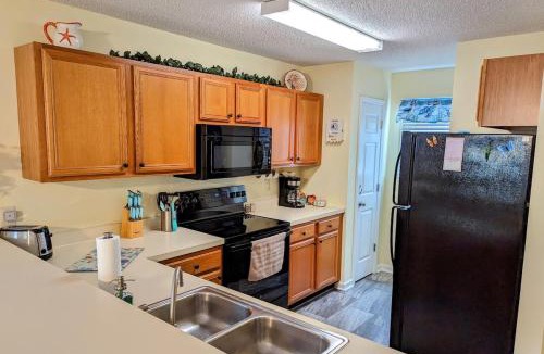 Surfside Beach Apartment | Centrally Located-Well Equipped Kitchen-Forest Views-Pools