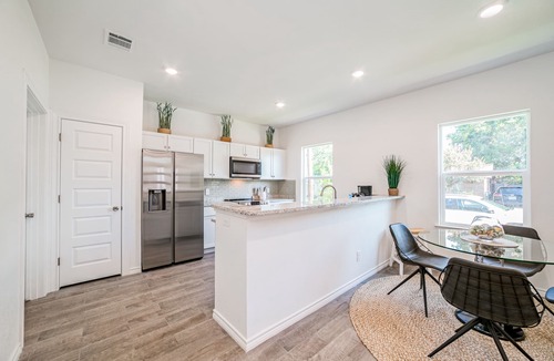Uptown House | CENTRALLY LOCATEDt! NEW ONE-STORY HOME near downtown. “Horace Whispers”