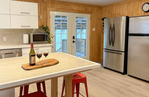 Lac-Superieur Ski Chalet | Chalet Crepuscule - lovely large waterfront chalet: SPA, pool & foosball tables